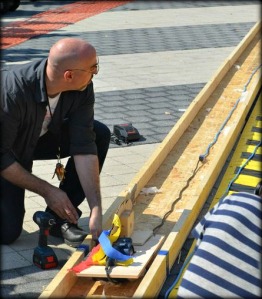 Alex Bandar prepares to launch a power tool racer at the Columbus Mini Maker Faire 2012